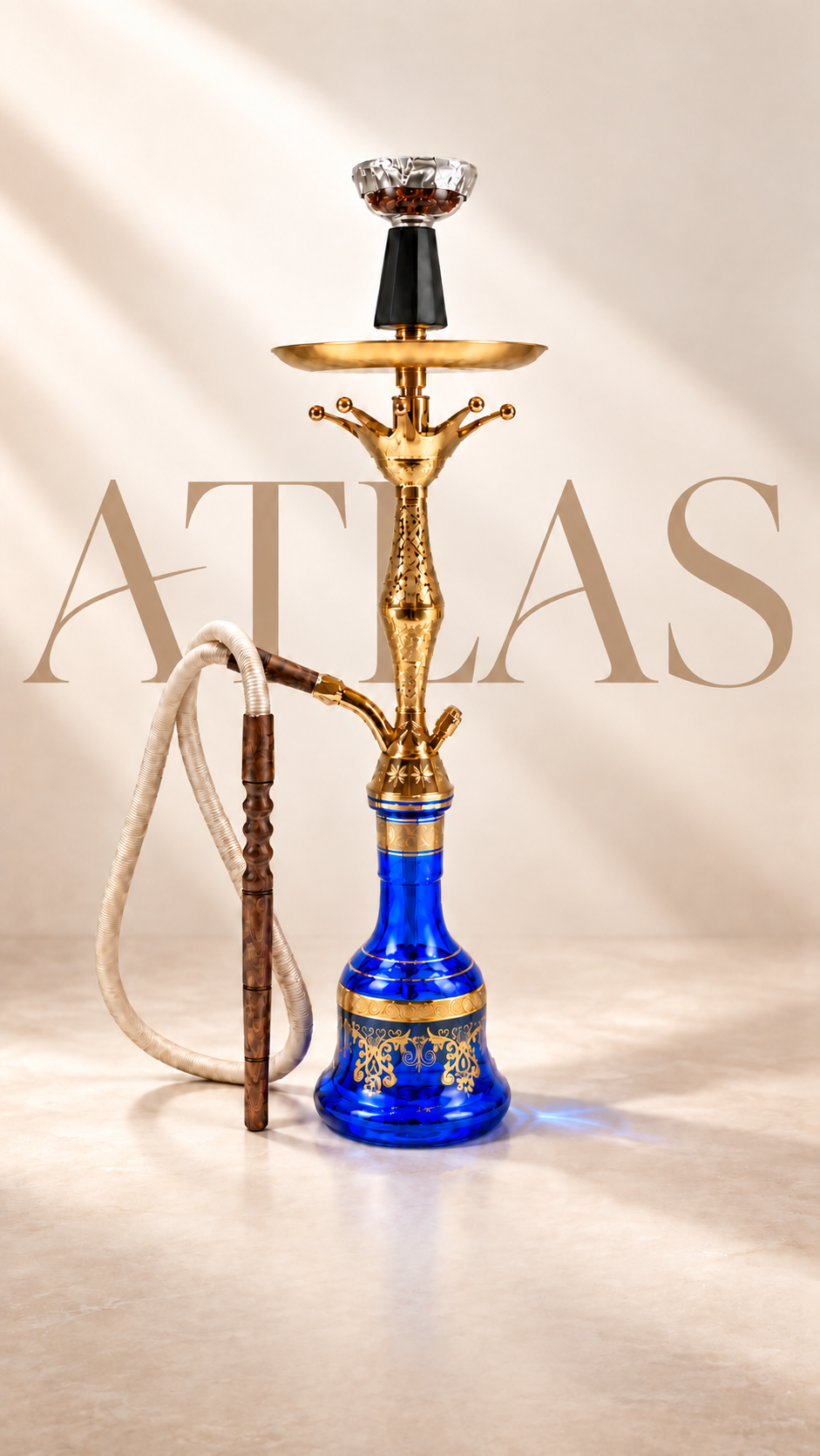 The Atlas Signature: engraved gold metalwork, a cobalt glass base and an ivory hose.